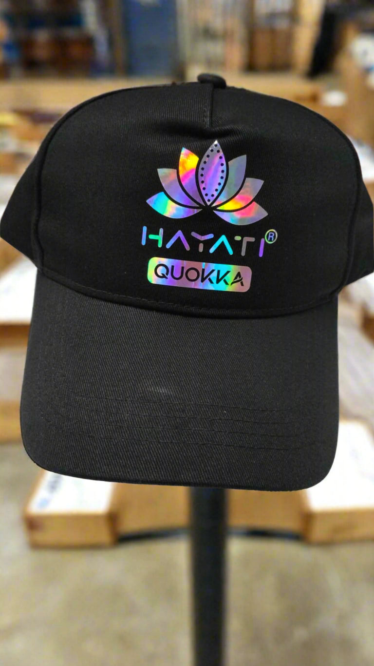 Black cap with colorful logo and text on a white surface

